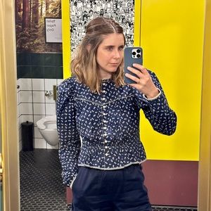 Doen blouse with puff sleeves and corset details, worn three times.